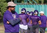 First-year Lemoore High School football coach Josh Kloster reviews his team during Tuesday practice session. The Tigers open their season Friday at Clovis East.